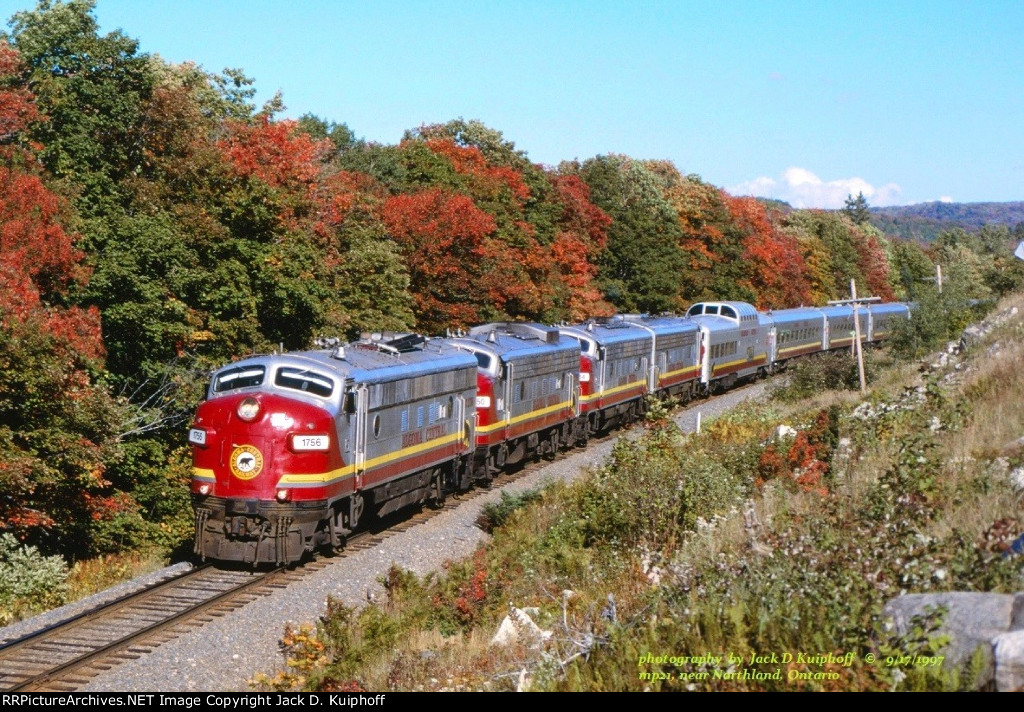 AC, Algoma Central Railway FP9s 1756-1750-1754-1755, with the southbound Agawa Canyon Tour train passing mp21, near Northland, Ontario. September 17, 1997.